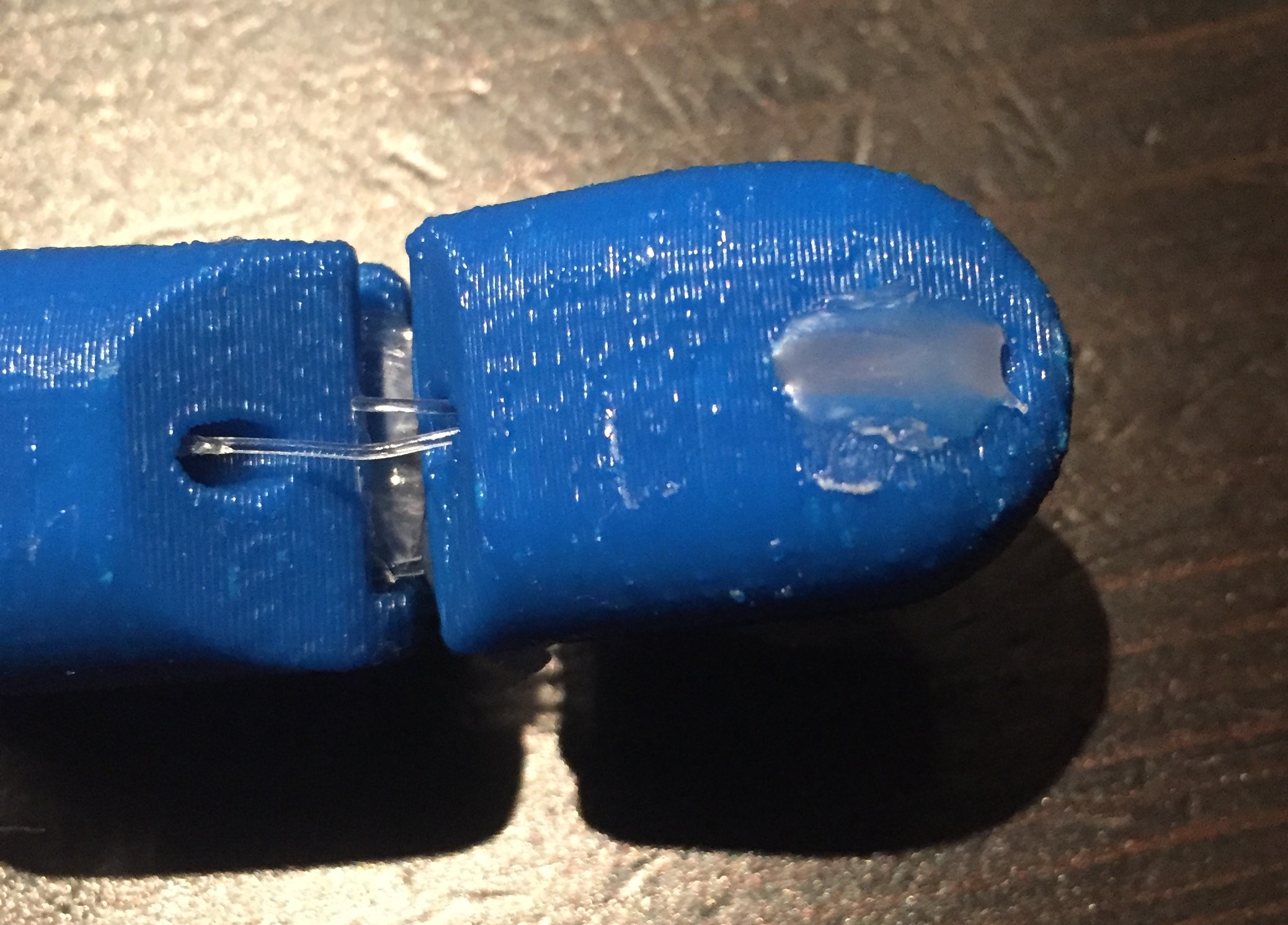 the Fishing Wire weaving through the top of the finger